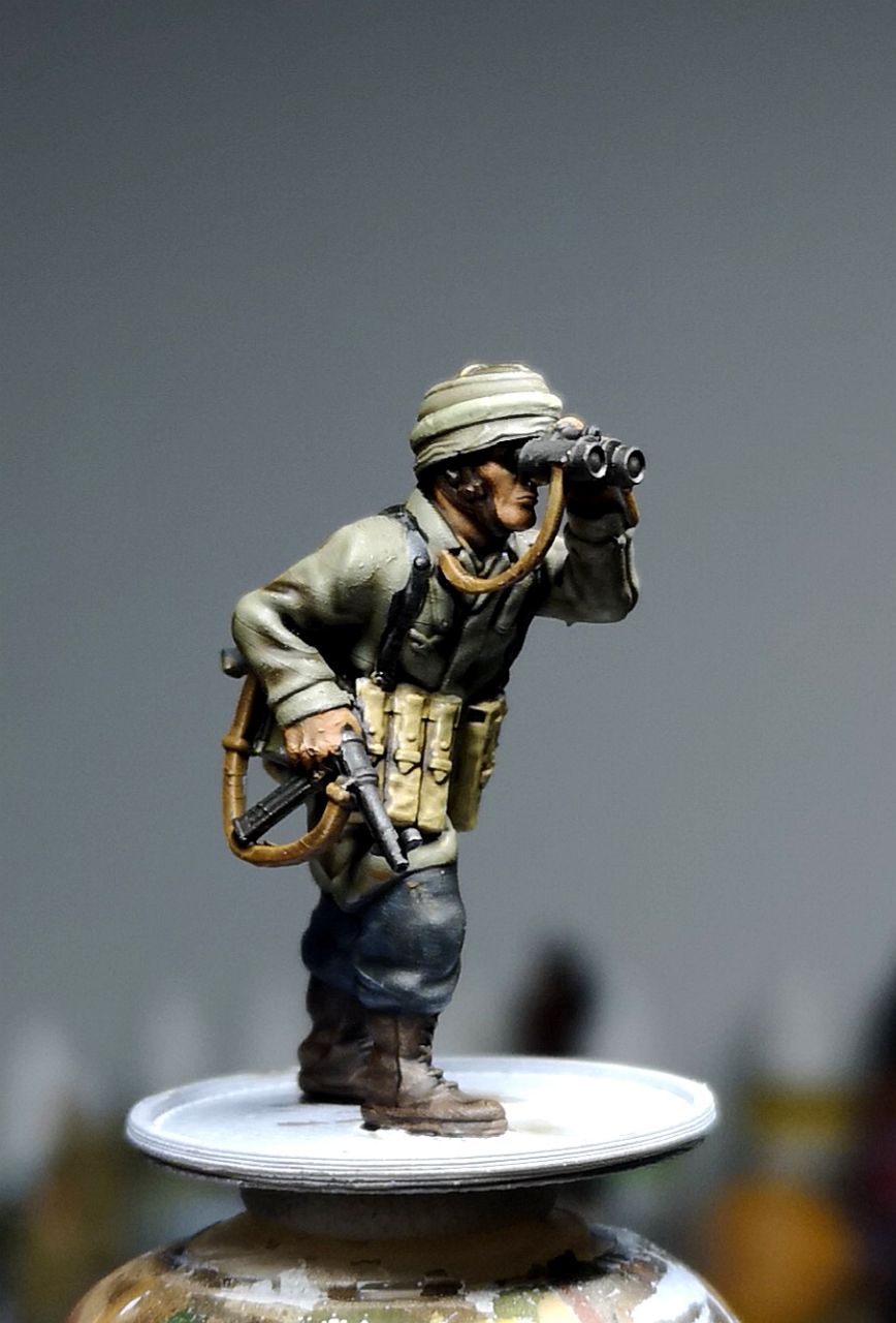 Col.Muller German Paratrooper NCO observing with binoculars.